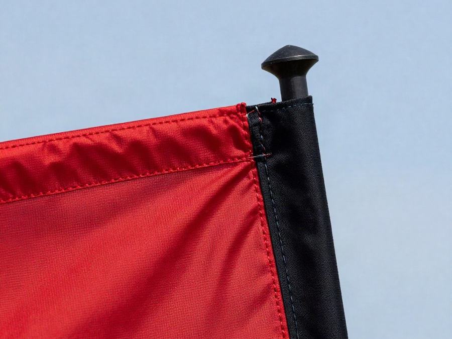 Close-up of a feather flag sleeve on its pole