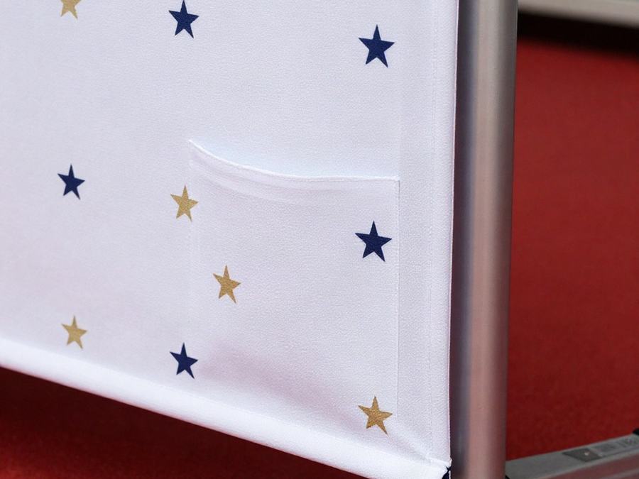 Close-up of a step and repeat backdrop on its telescoping stand